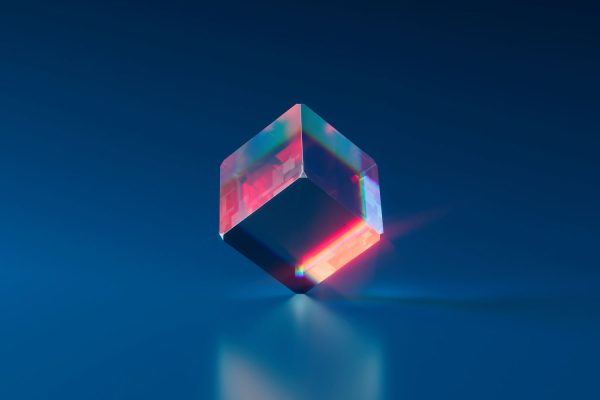 Futuristic glass cube with holographic reflections on blue background.